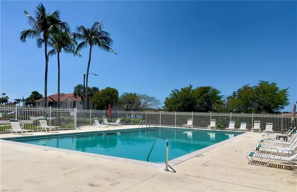 a view of a swimming pool with a lake view
