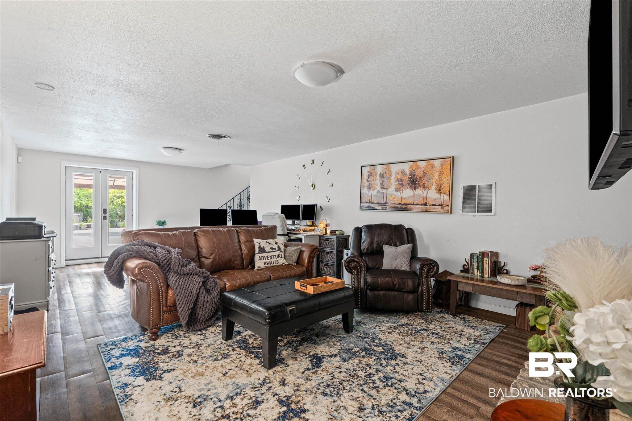 4213 Shan Drive East Mobile, AL 36693 - Photo 20 of 35 Spacious room featuring wood-finish flooring, white walls, and recessed lighting. Fireplace gas is not connected at this time.