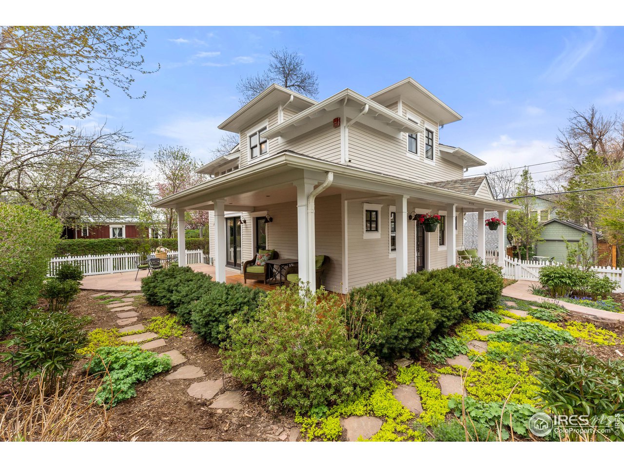 Undisclosed Address Boulder, CO 80304 - Photo 1 of 1 a view of a white house next to a yard with big trees