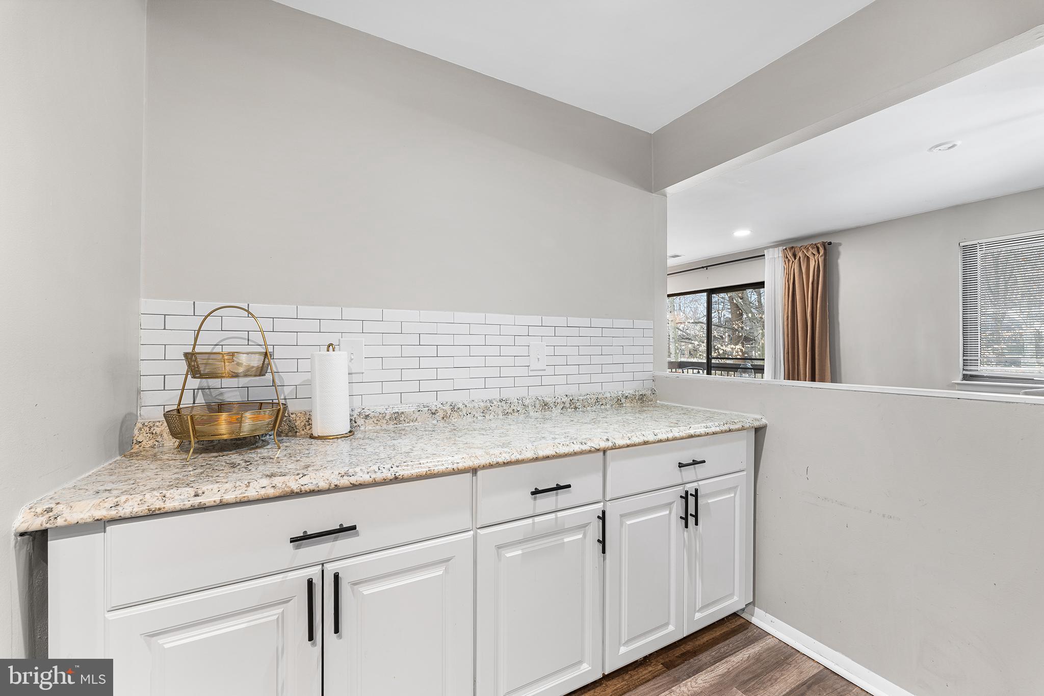 115 East Kings Highway, Unit 186 Maple Shade, NJ 08052 - Photo 10 of 25 a kitchen with granite countertop white cabinets and sink