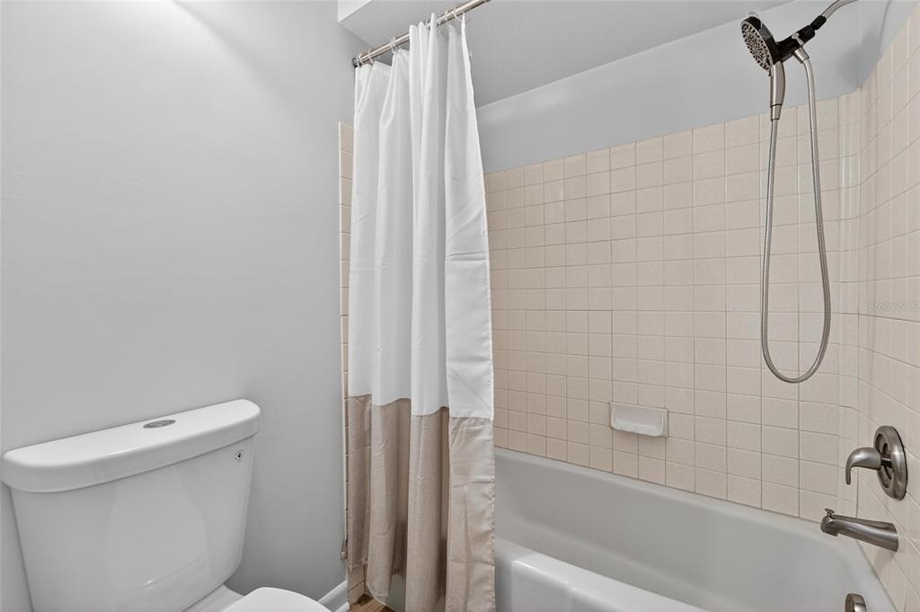 13610 South Village Drive, Unit 4209 Tampa, FL 33618 - Photo 17 of 54 a bathroom with a shower and a toilet
