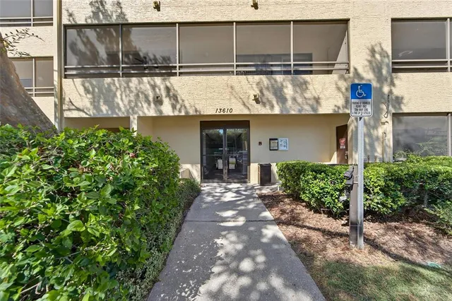 a view of a hallway with wooden floor and a small space