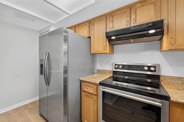 a view of street with parked cars