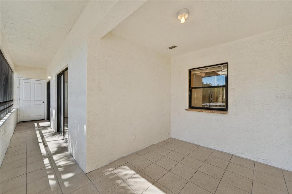 13610 South Village Drive, Unit 4209 Tampa, FL 33618 - Photo 30 of 54 a view of a hallway with a bathroom