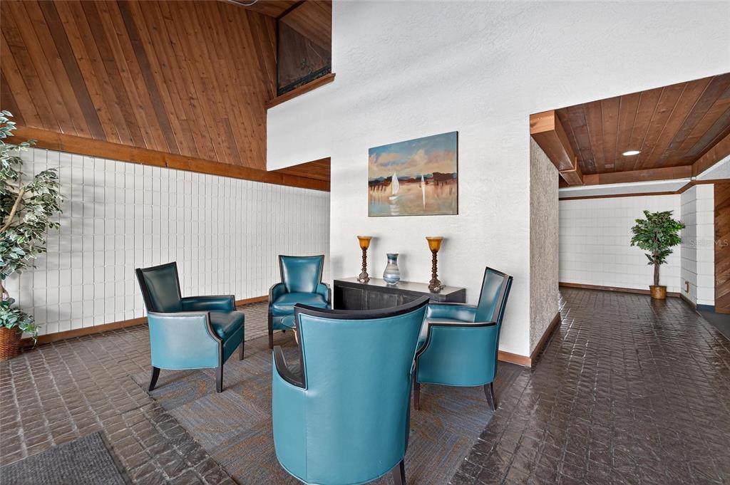 13610 South Village Drive, Unit 4209 Tampa, FL 33618 - Photo 39 of 54 a living room with furniture and a potted plant