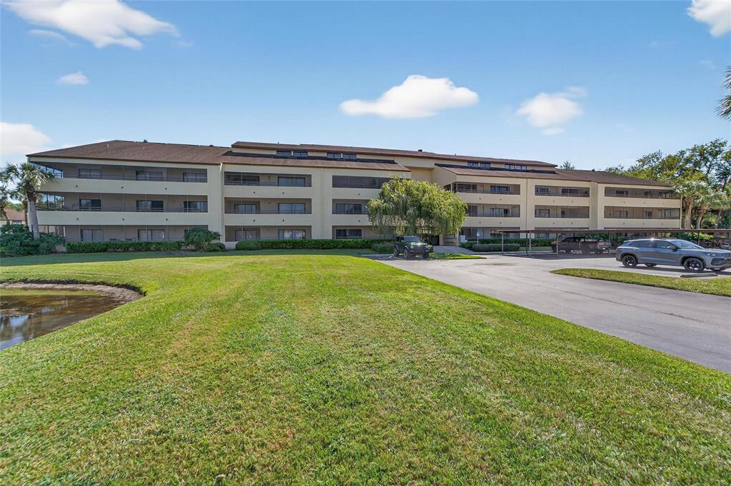 13610 South Village Drive, Unit 4209 Tampa, FL 33618 - Photo 44 of 54 a view of a swimming pool with an outdoor space and seating area
