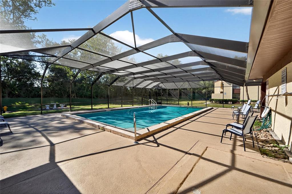 13610 South Village Drive, Unit 4209 Tampa, FL 33618 - Photo 52 of 54 a view of a tennis room with wooden floor