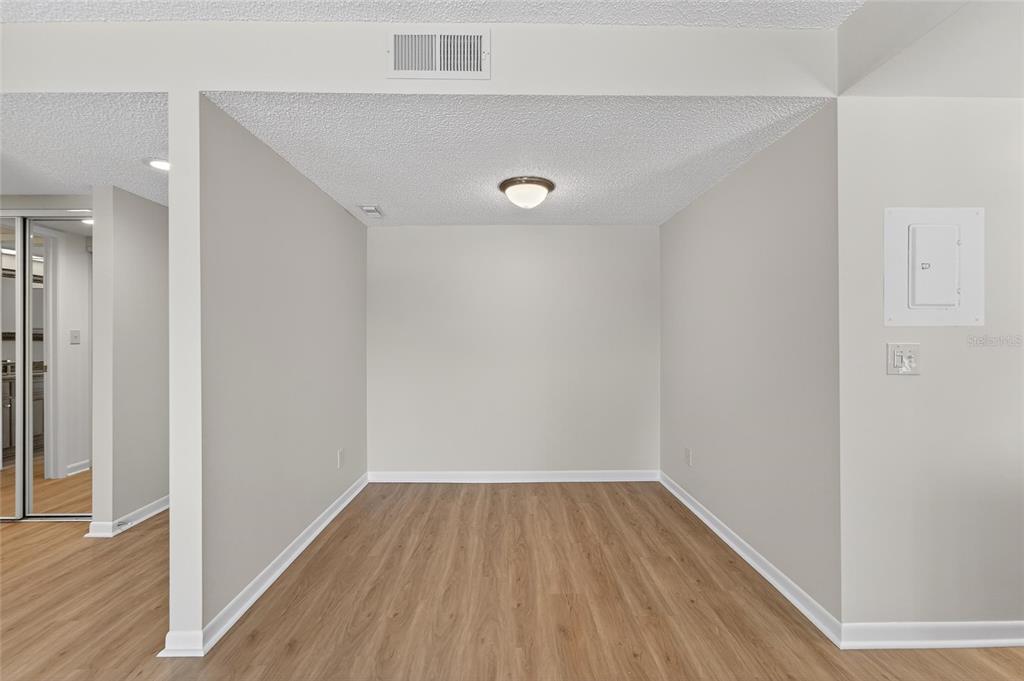 13610 South Village Drive, Unit 4209 Tampa, FL 33618 - Photo 7 of 54 a view of a hallway with wooden floor