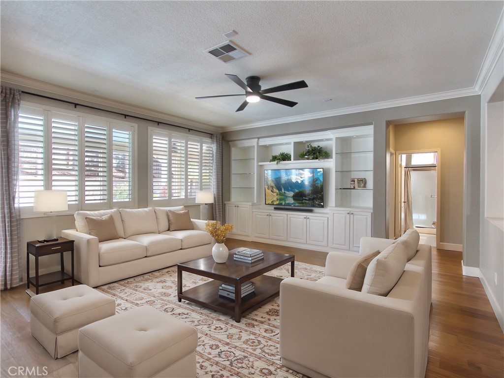1442 Midnight Sun Drive Beaumont, CA 92223 - Photo 14 of 46 a living room with furniture and a large window