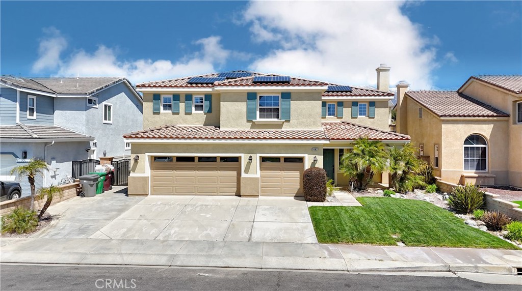 1442 Midnight Sun Drive Beaumont, CA 92223 - Photo 2 of 46 a front view of a house with a yard