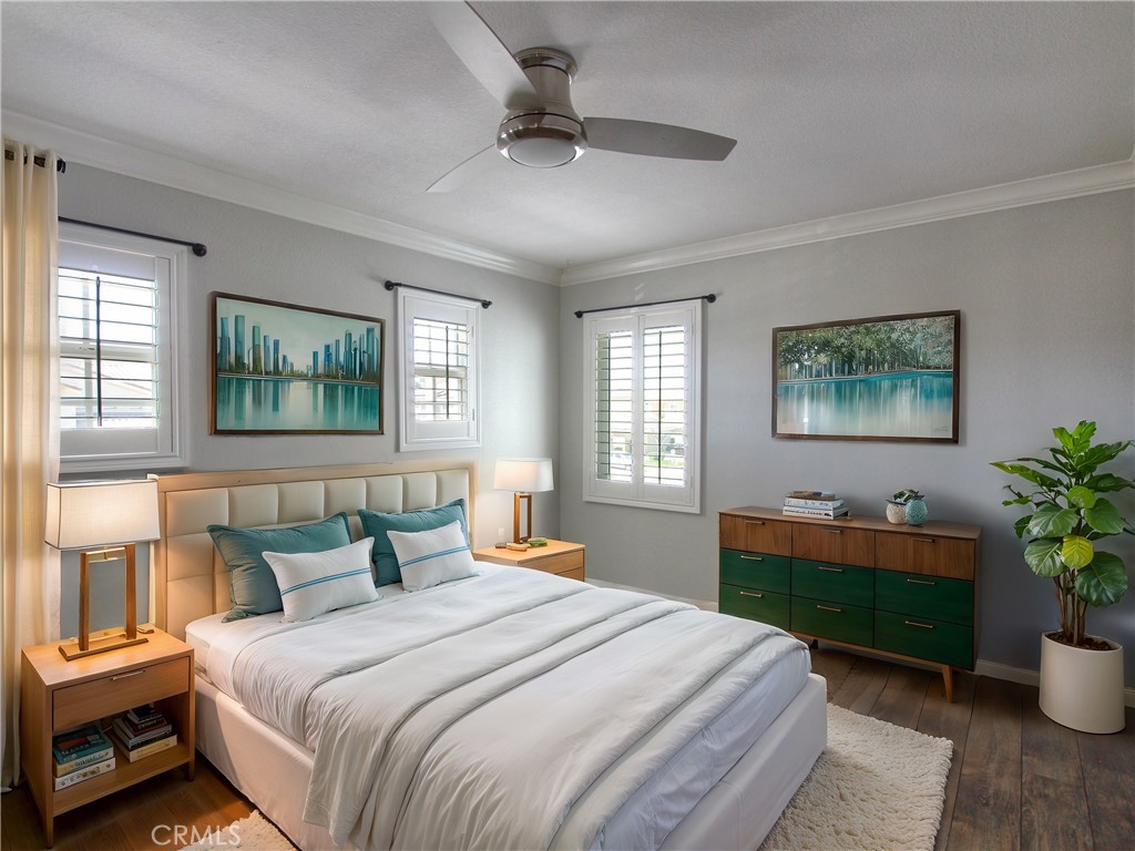 1442 Midnight Sun Drive Beaumont, CA 92223 - Photo 27 of 46 a bedroom with a bed and a potted plant