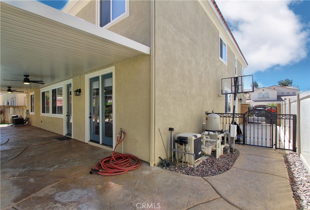 1442 Midnight Sun Drive Beaumont, CA 92223 - Photo 43 of 46 a patio with a table and chairs