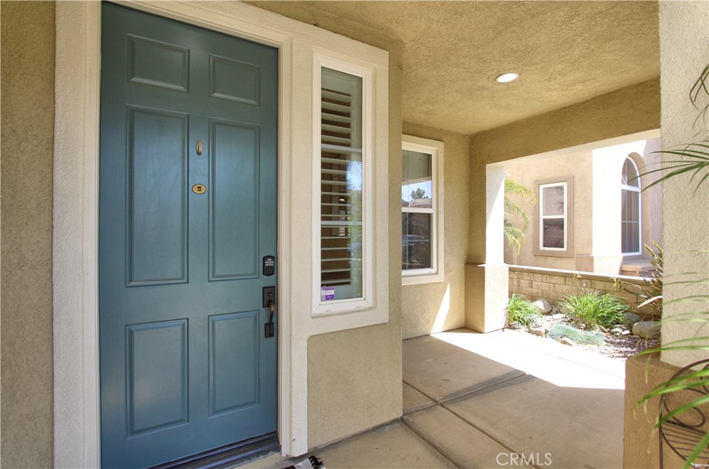 1442 Midnight Sun Drive Beaumont, CA 92223 - Photo 5 of 46 a front view of a house with a garage