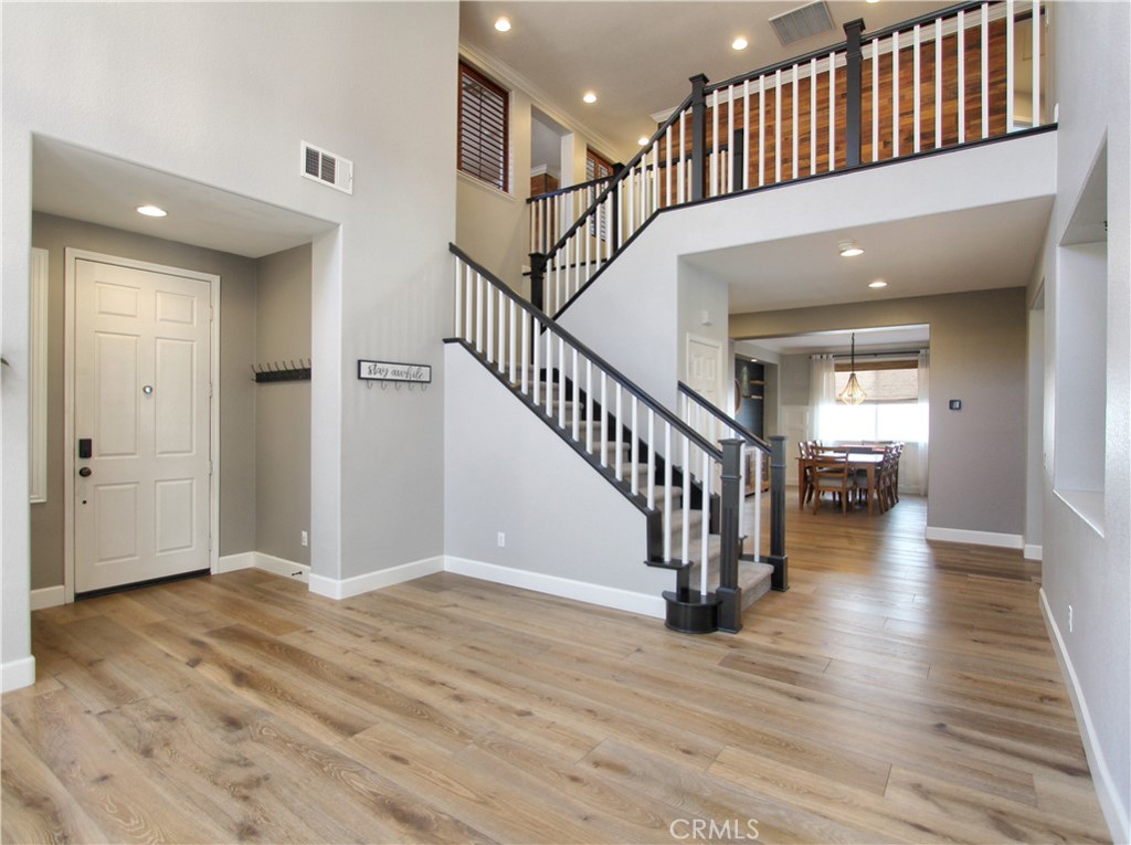 1442 Midnight Sun Drive Beaumont, CA 92223 - Photo 9 of 46 a view of entryway and hall with wooden floor