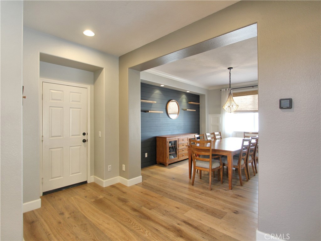 1442 Midnight Sun Drive Beaumont, CA 92223 - Photo 10 of 46 a view of a dining room with furniture and chandelier