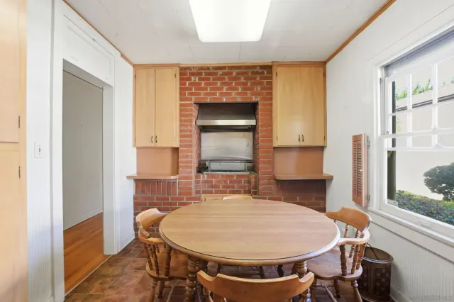 a dining room with a table and chairs