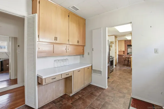 a view of a kitchen cabinets and a wooden floor