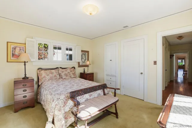 a bedroom with a bed and a couch