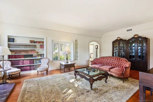 a living room with furniture rug and window
