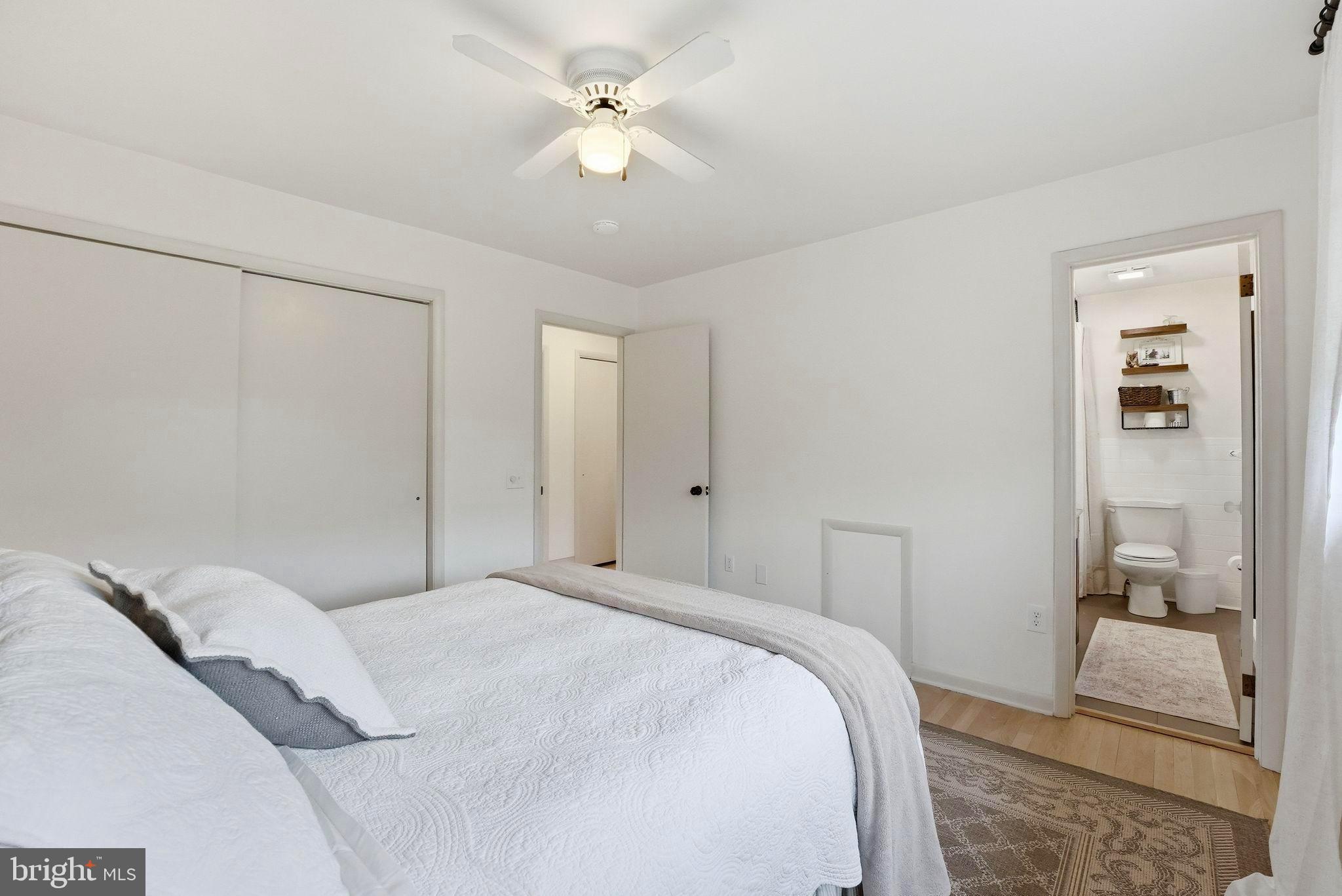 481 James City Road Leon, VA 22725 - Photo 25 of 89 a bedroom with a large bed and a chandelier