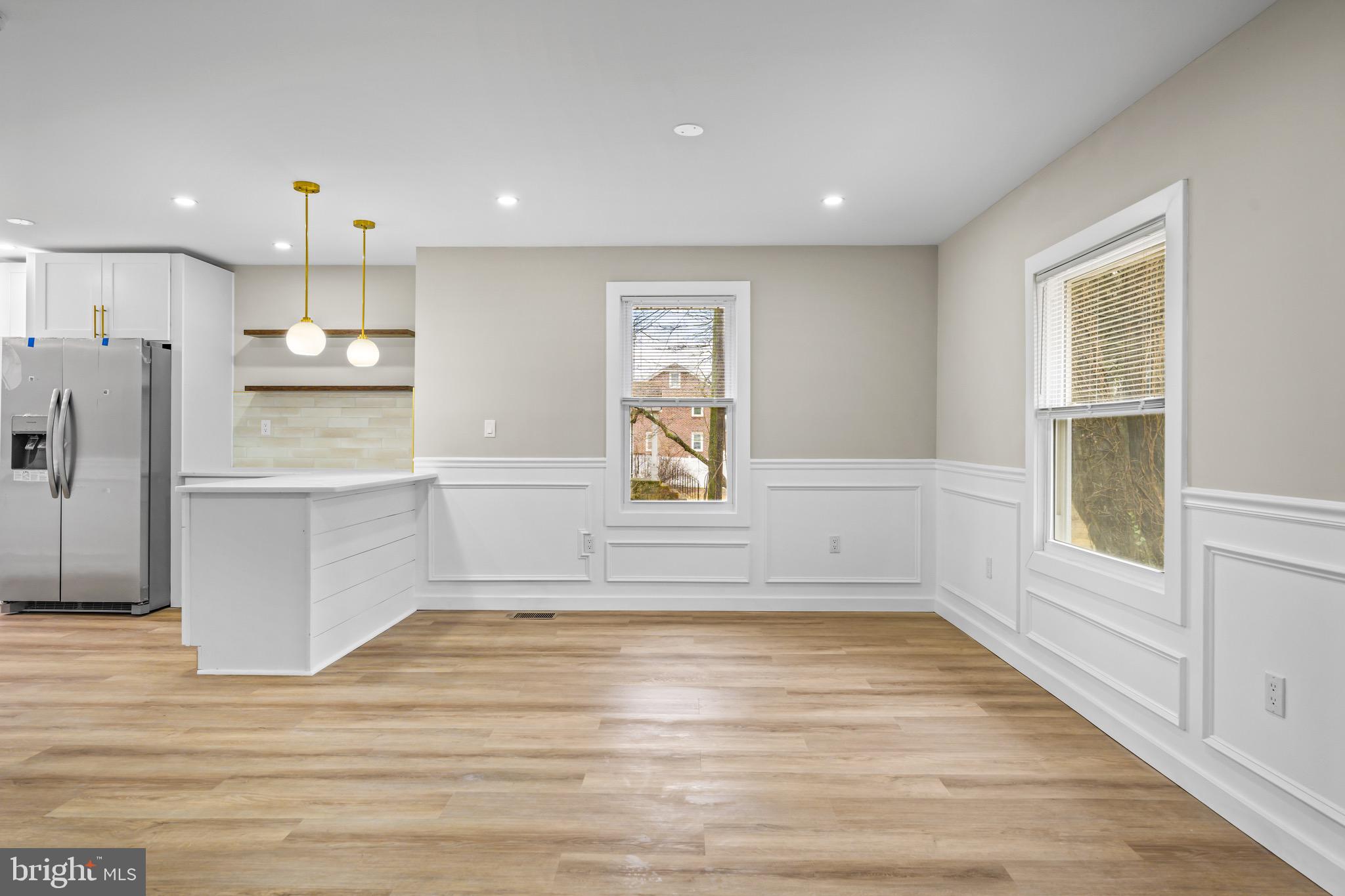 613 Hawks Bridge Road Carneys Point, NJ 08069 - Photo 12 of 38 a view of a kitchen with wooden floor and a window