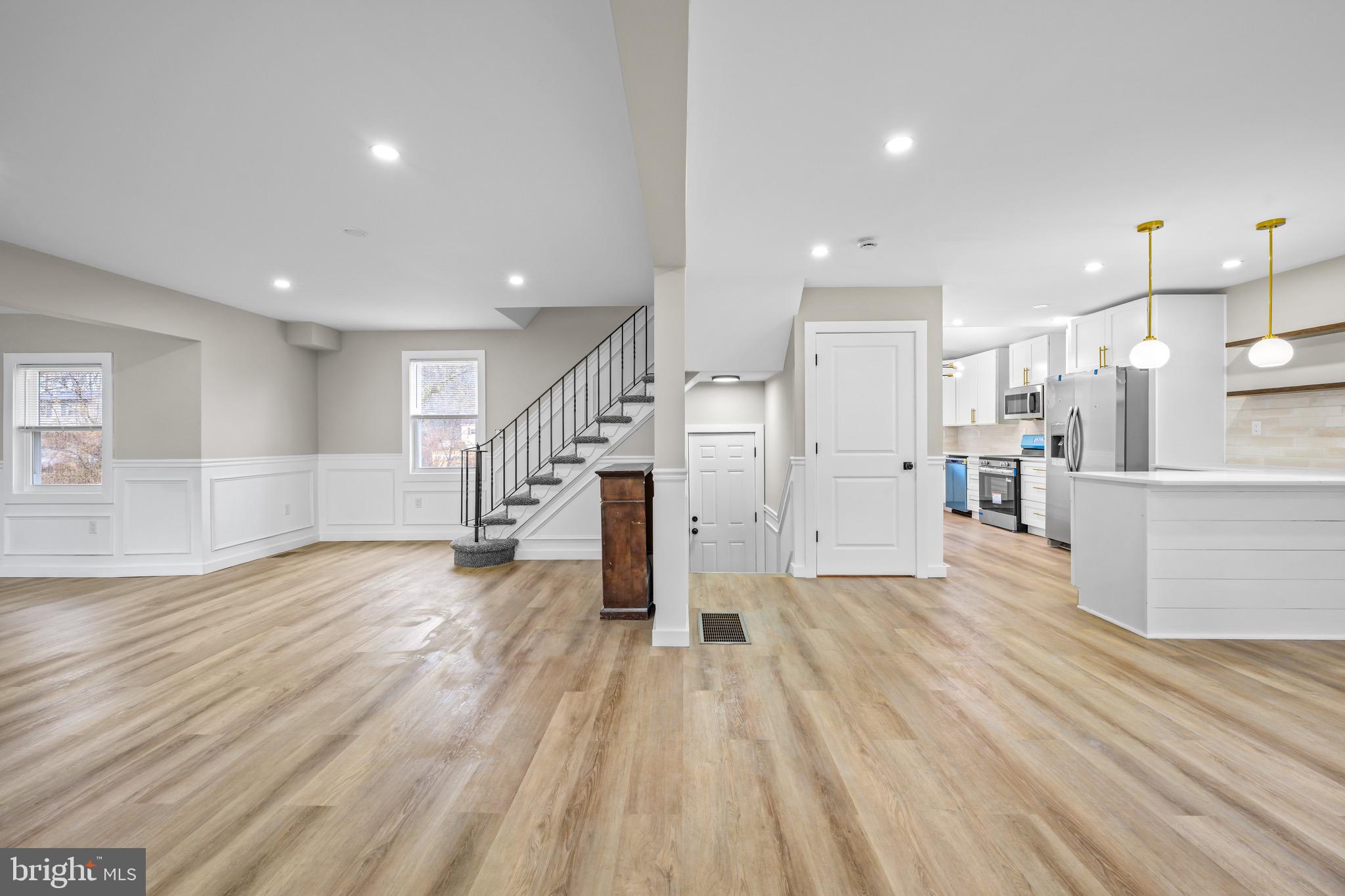 613 Hawks Bridge Road Carneys Point, NJ 08069 - Photo 4 of 38 a view of a kitchen with wooden floor and electronic appliances