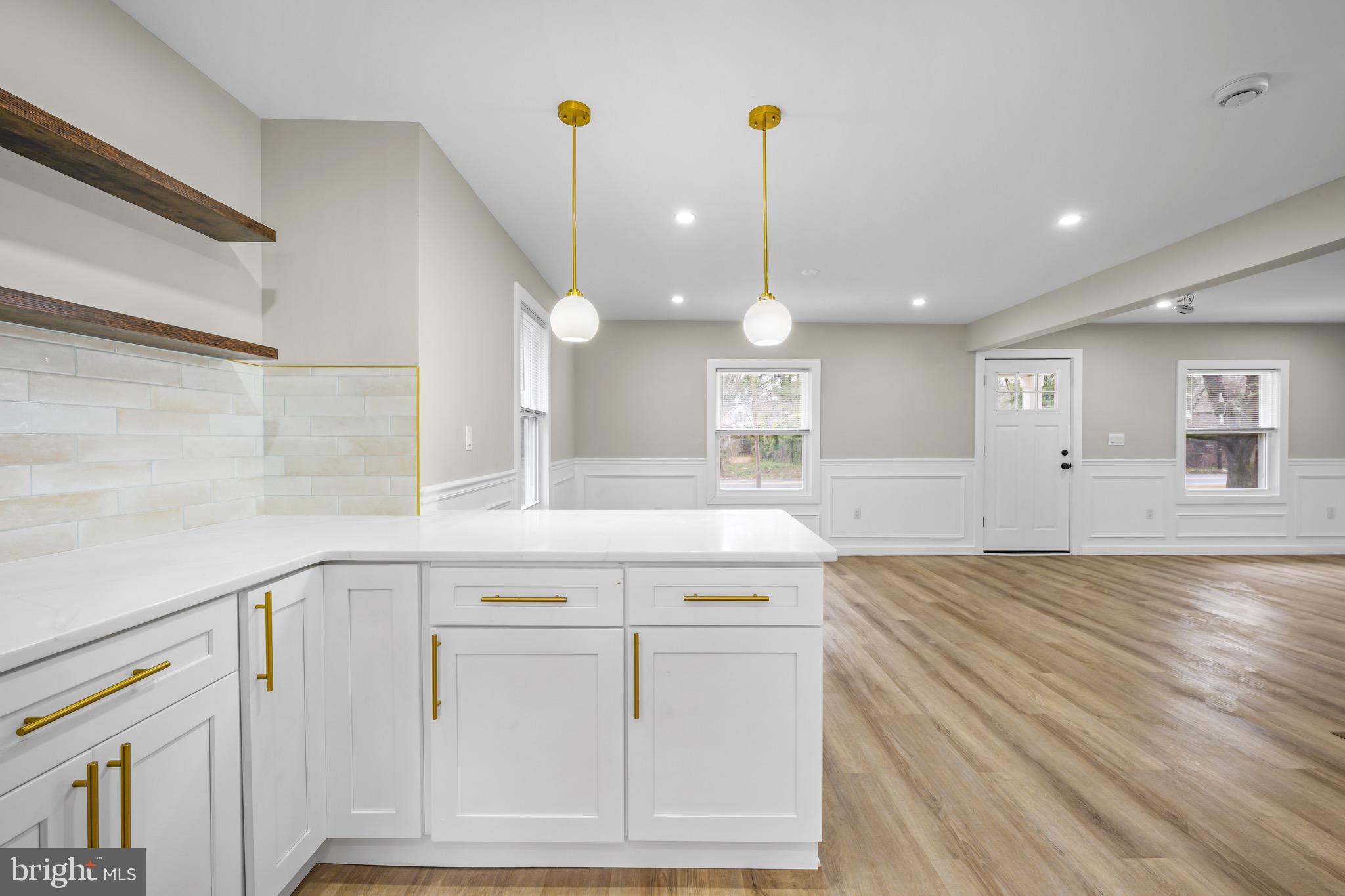 613 Hawks Bridge Road Carneys Point, NJ 08069 - Photo 7 of 38 a view of a kitchen with a sink and dishwasher with wooden floor