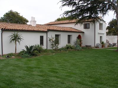 a house with a tree in front of it