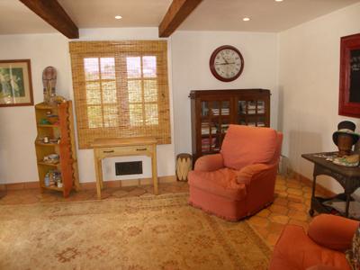 318 Mohawk Road Santa Barbara, CA 93109 - Photo 4 of 15 a living room with furniture a fireplace and a flat screen tv