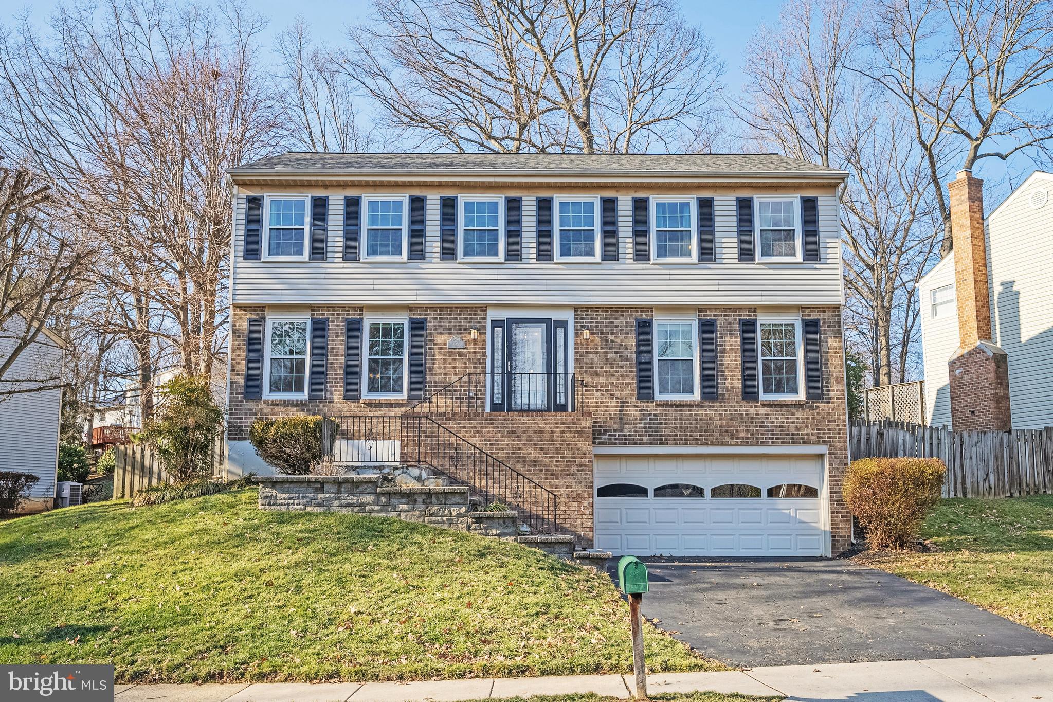 10655 John Ayres Drive Fairfax, VA 22032 - Photo 1 of 57 a front view of a house with garden