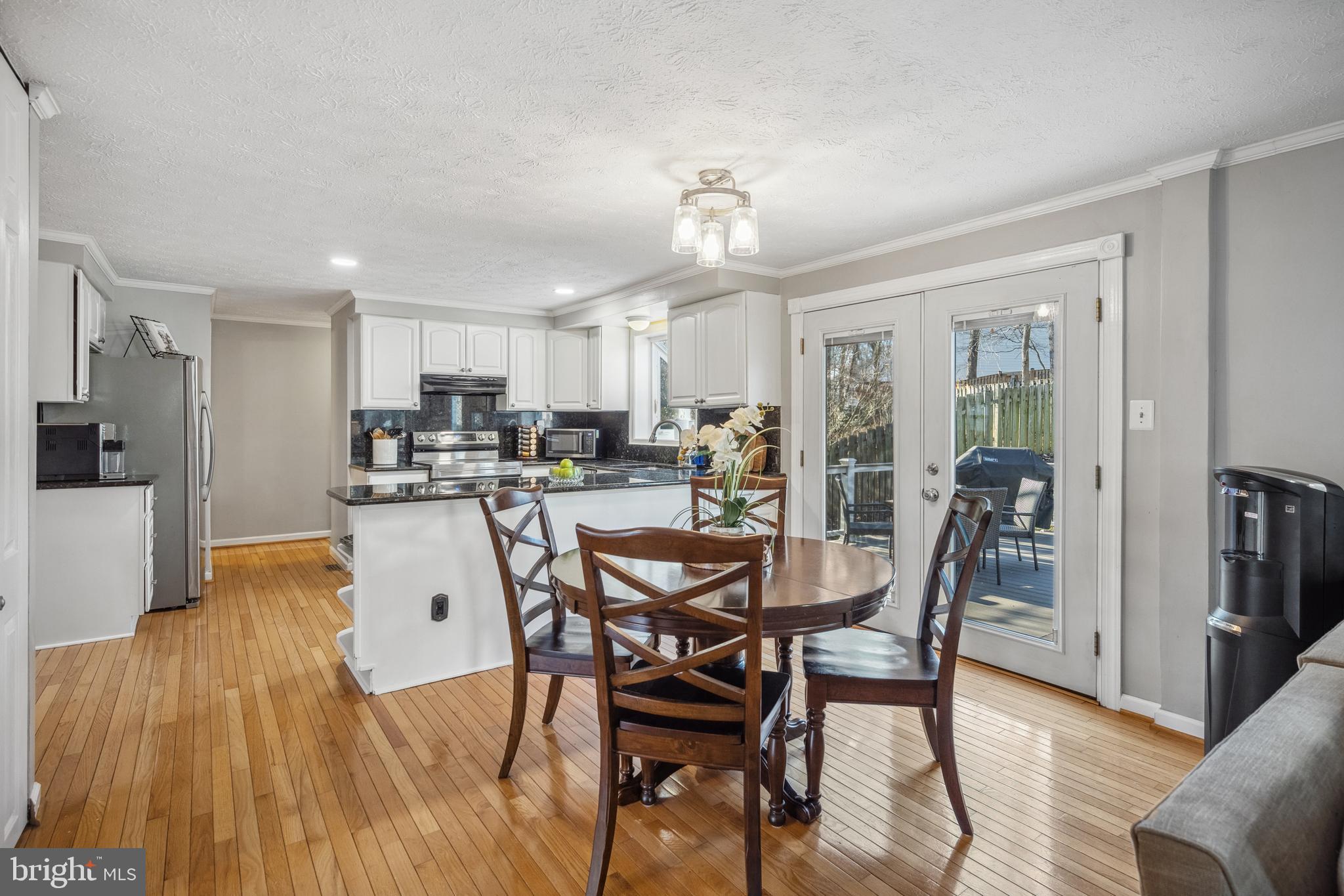 10655 John Ayres Drive Fairfax, VA 22032 - Photo 12 of 57 a view of a dining room with furniture and a chandelier