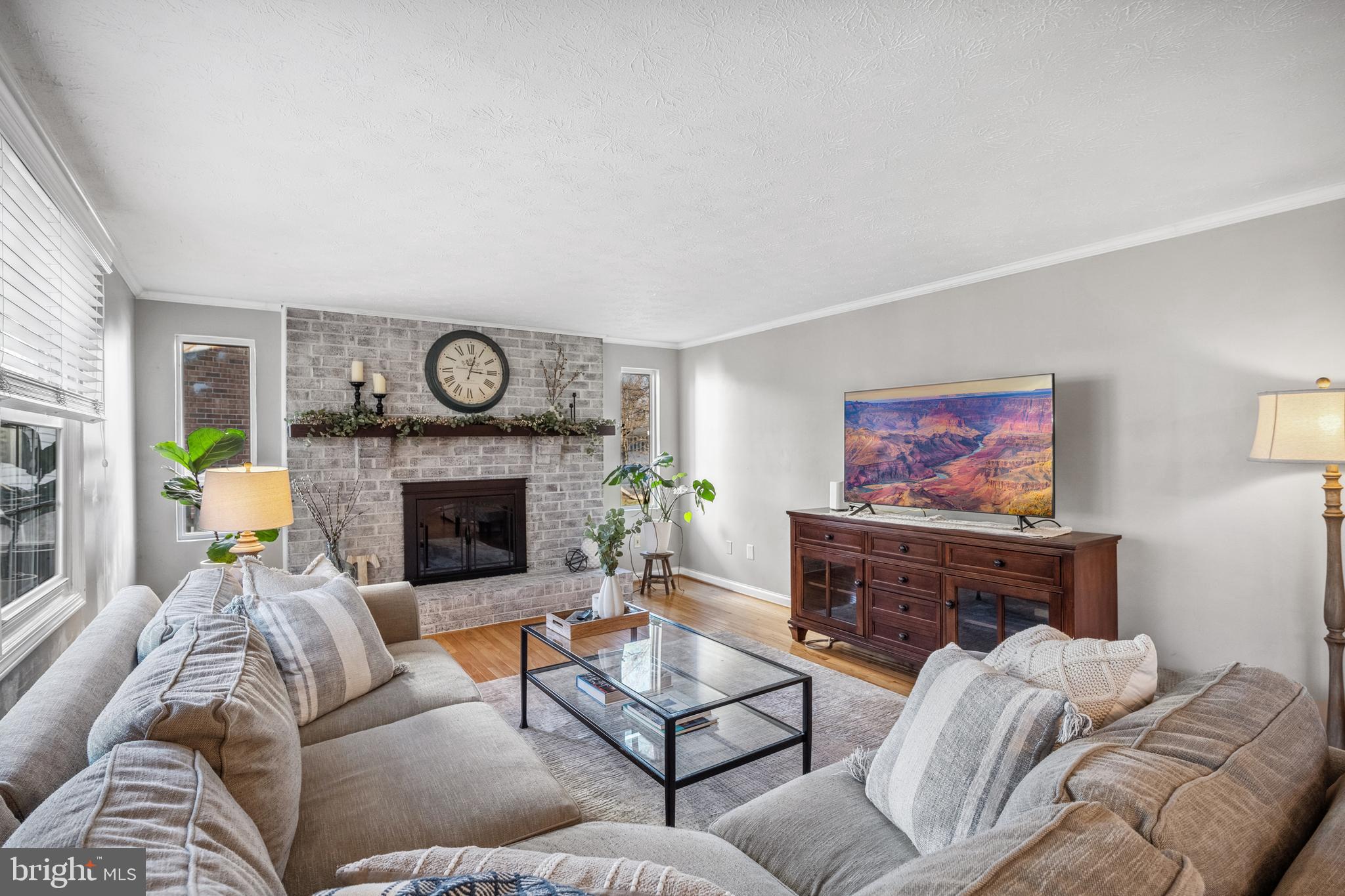 10655 John Ayres Drive Fairfax, VA 22032 - Photo 15 of 57 a living room with furniture and a fireplace