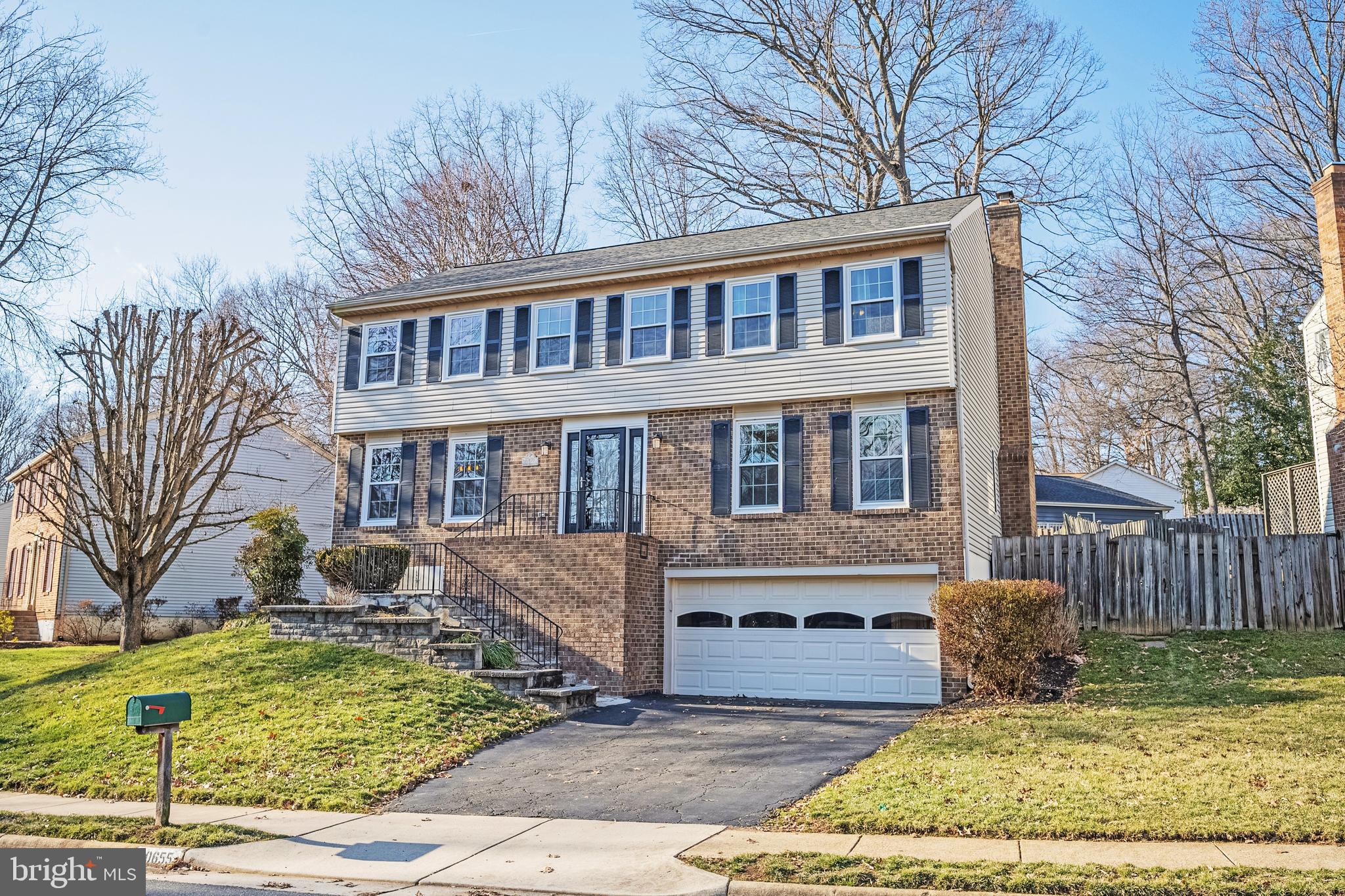 10655 John Ayres Drive Fairfax, VA 22032 - Photo 2 of 57 a front view of a house with garden