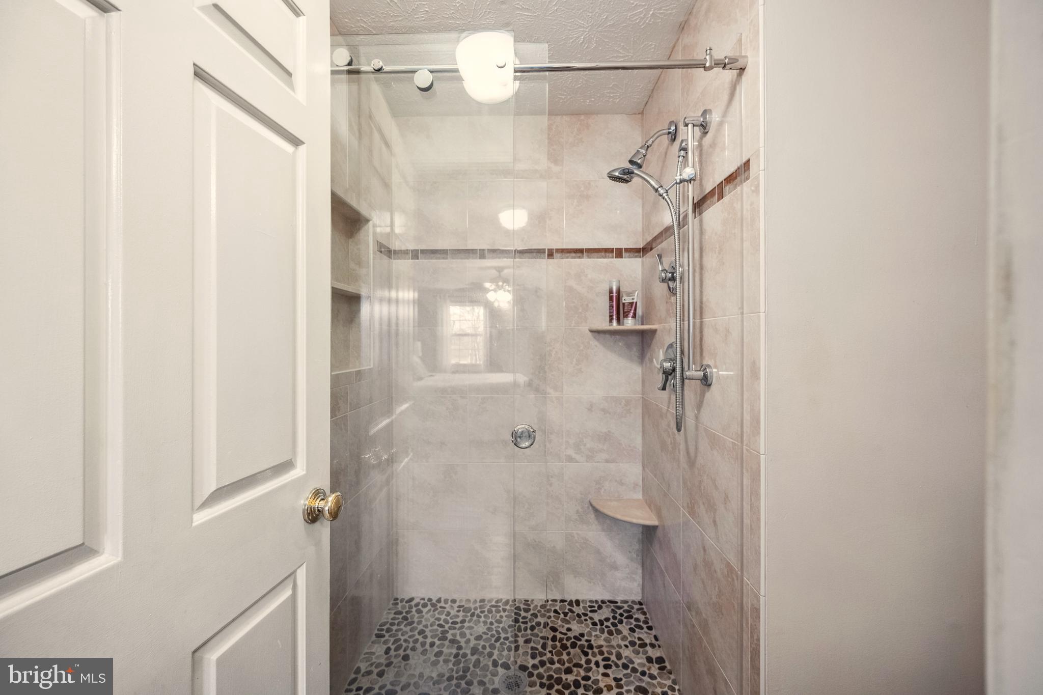 10655 John Ayres Drive Fairfax, VA 22032 - Photo 22 of 57 a bathroom with a shower