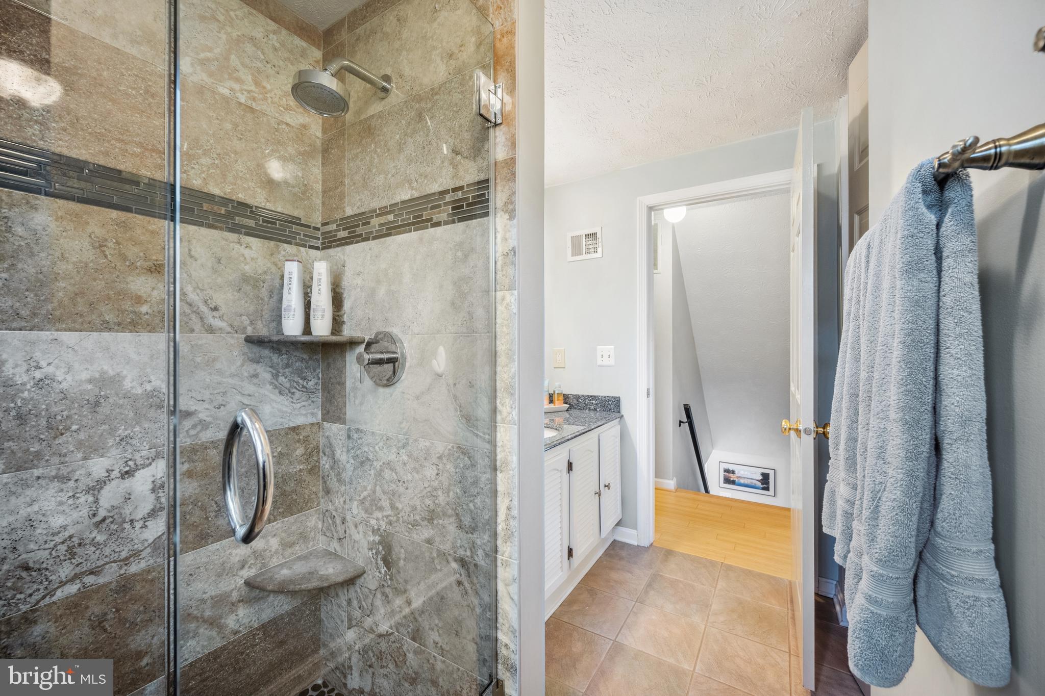 10655 John Ayres Drive Fairfax, VA 22032 - Photo 29 of 57 a bathroom with a shower and a tub