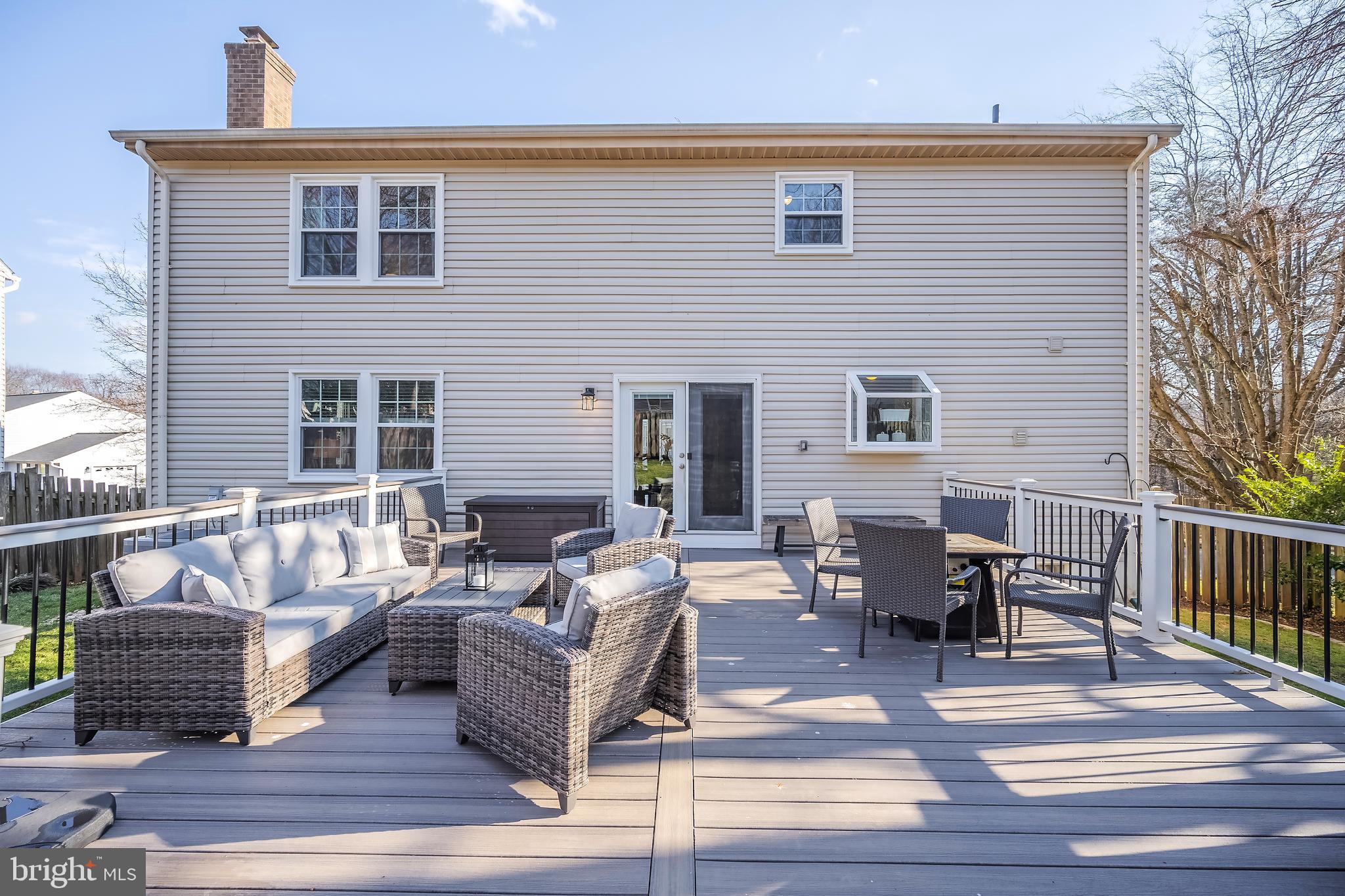 10655 John Ayres Drive Fairfax, VA 22032 - Photo 42 of 57 a outdoor space with patio the couches and a dining table with balcony view
