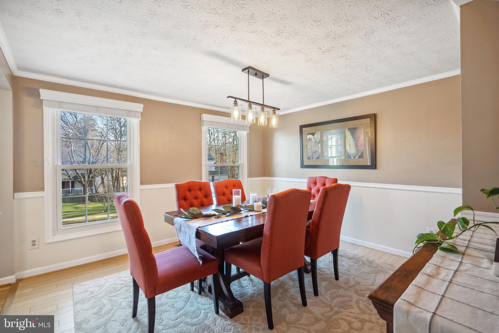 10655 John Ayres Drive Fairfax, VA 22032 - Photo 6 of 57 a dining room with furniture a rug and a potted plant