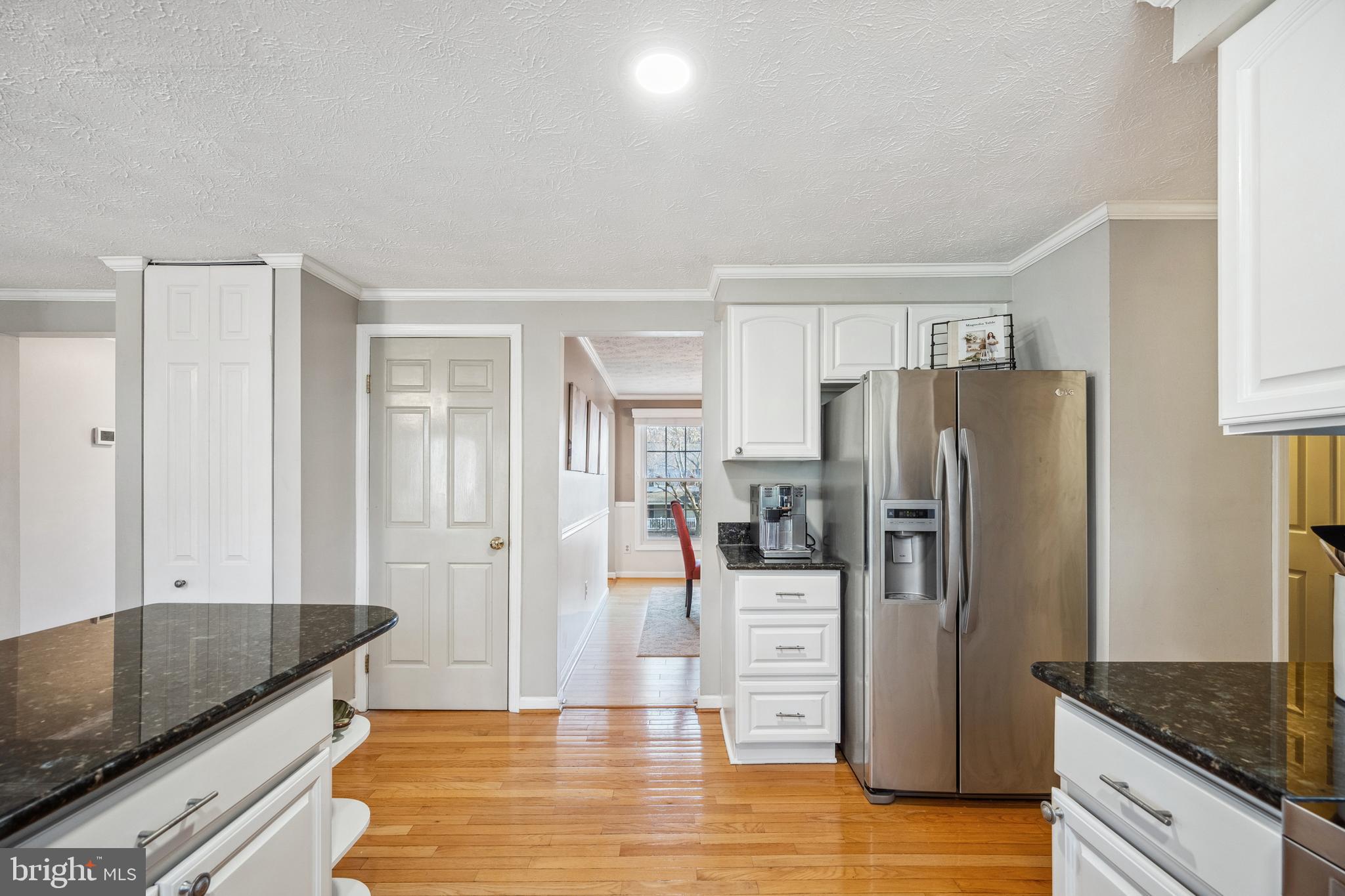 10655 John Ayres Drive Fairfax, VA 22032 - Photo 10 of 57 a kitchen with granite countertop a refrigerator and a sink