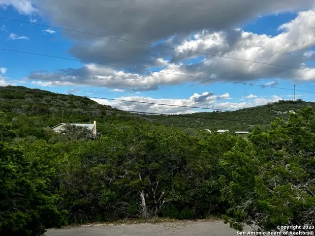 a view of a street with a trees