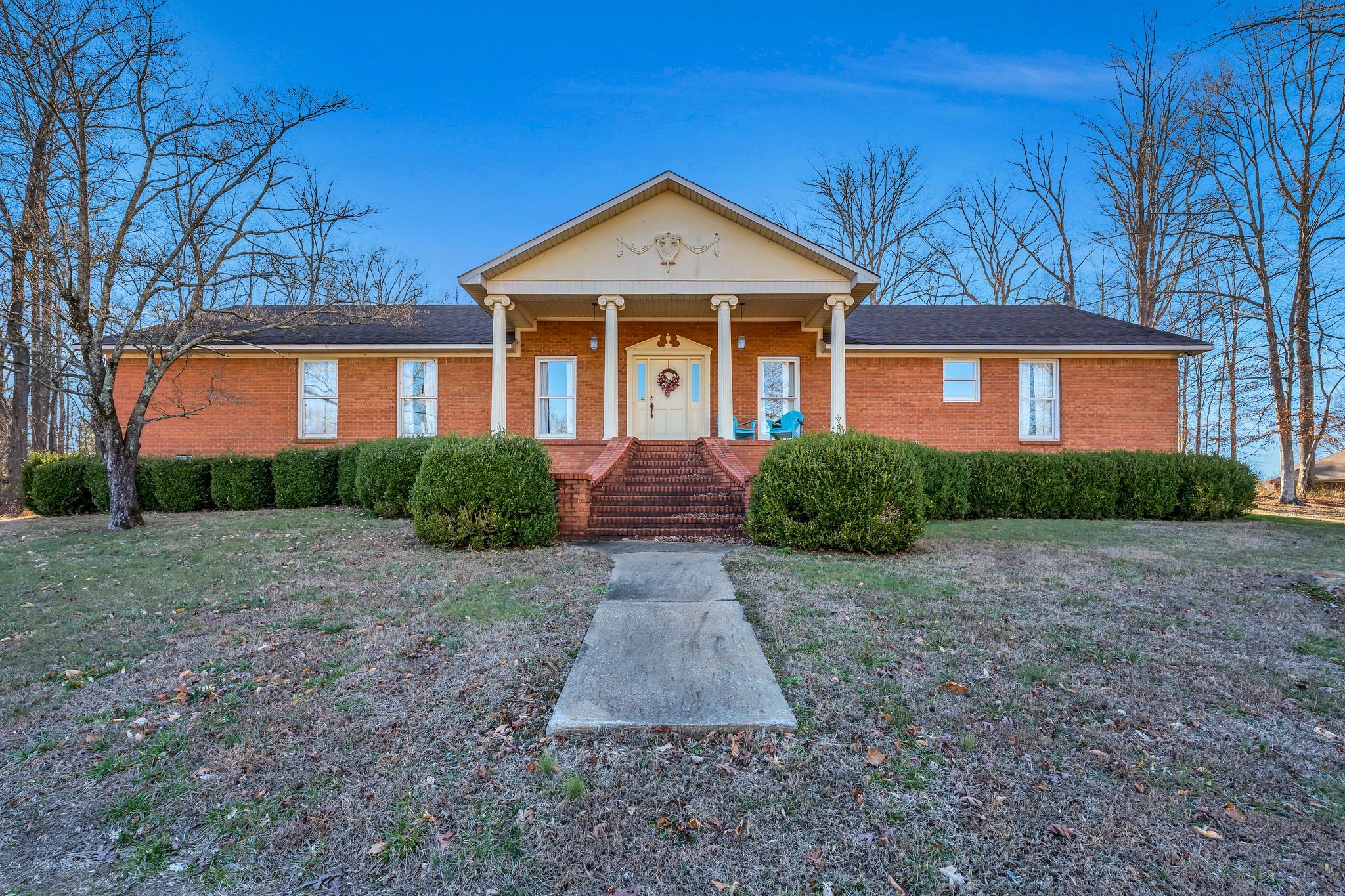 729 Rabbit Trail Road Leoma, TN 38468 - Photo 1 of 52 a front view of a house with a yard and garage