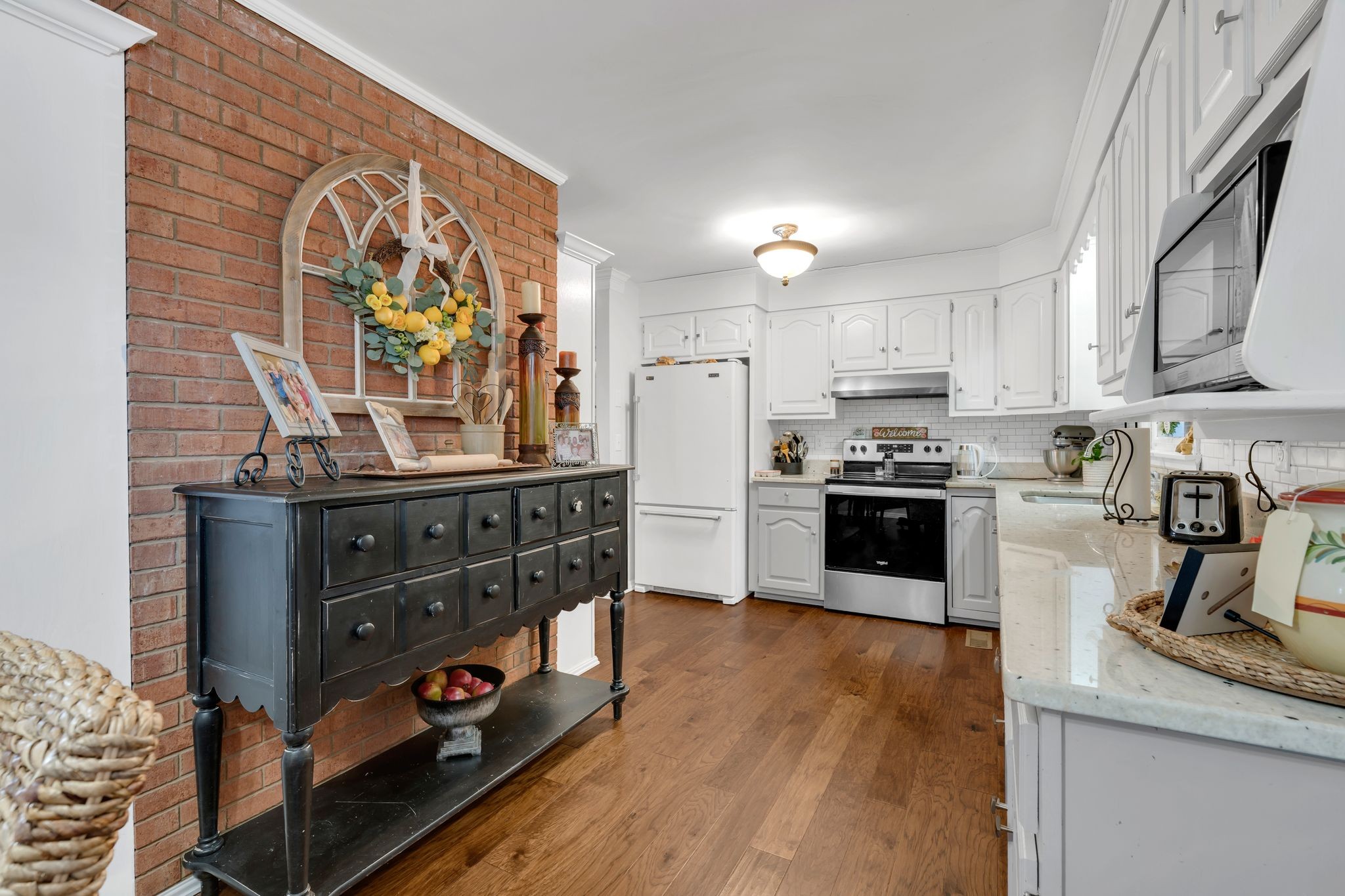 729 Rabbit Trail Road Leoma, TN 38468 - Photo 14 of 52 a kitchen with stainless steel appliances granite countertop a stove a sink and a microwave