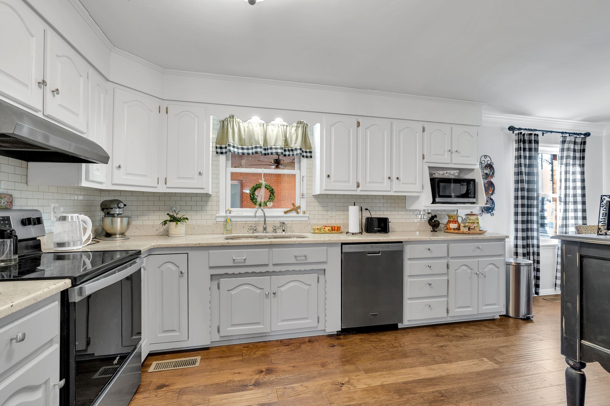 729 Rabbit Trail Road Leoma, TN 38468 - Photo 15 of 52 a kitchen with granite countertop white cabinets and white appliances