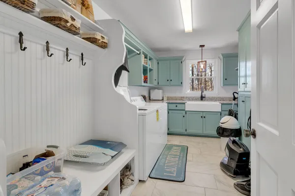 a living room with fireplace furniture and a wooden floor