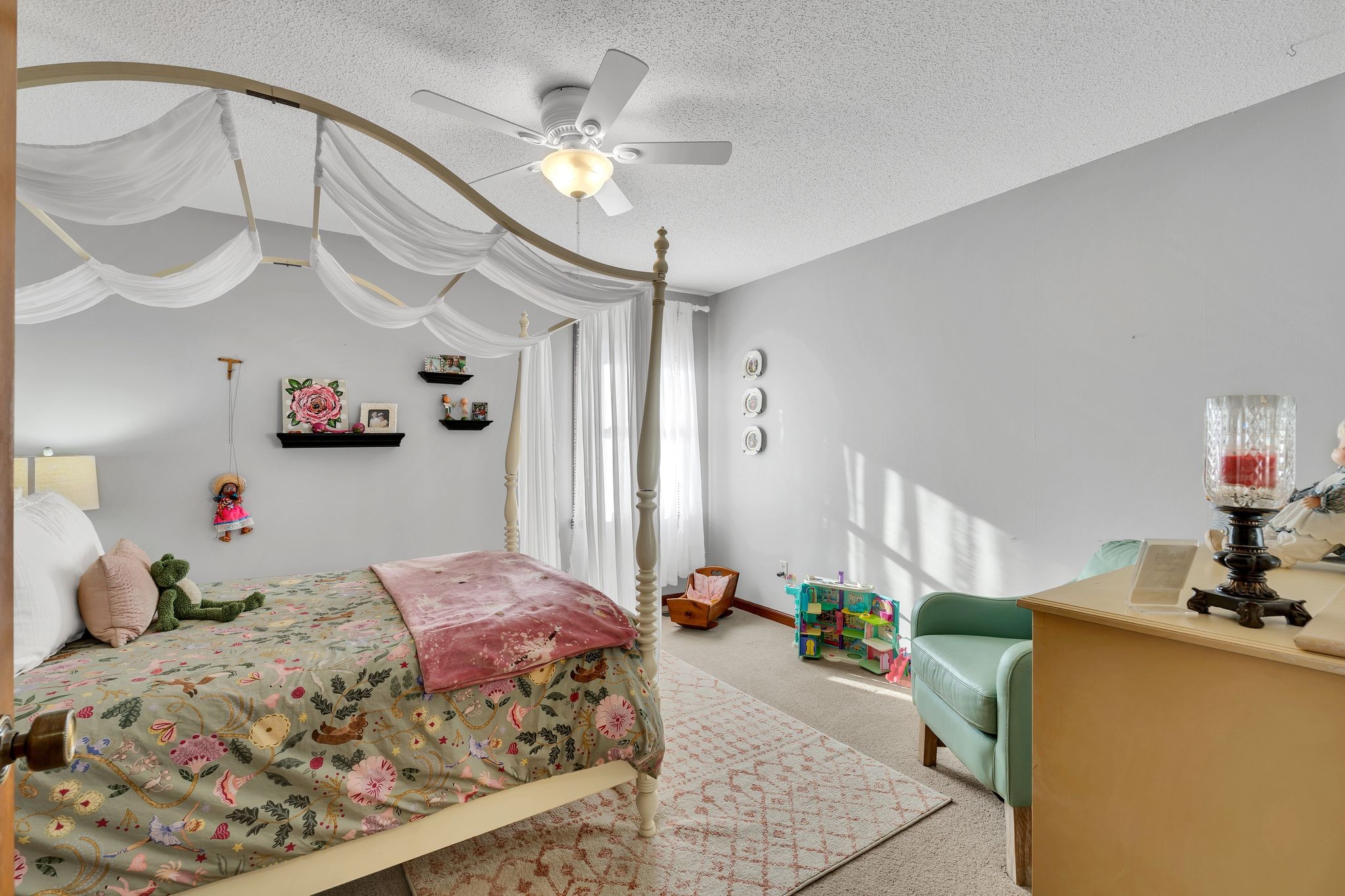 729 Rabbit Trail Road Leoma, TN 38468 - Photo 30 of 52 a bed room with a bed mirror and a chandelier