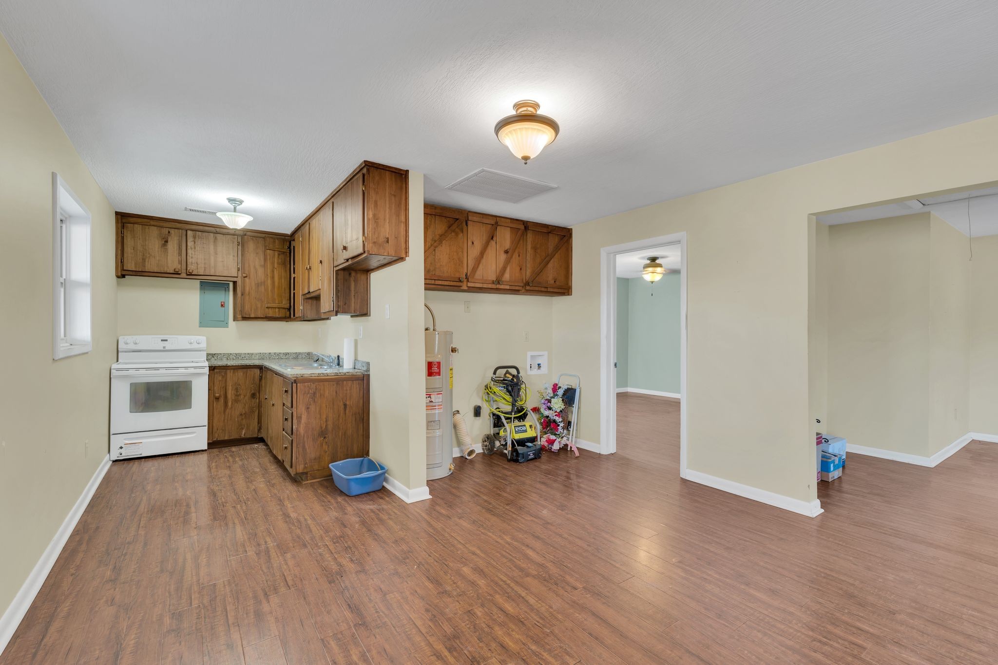729 Rabbit Trail Road Leoma, TN 38468 - Photo 43 of 52 a living room with kitchen island furniture and a wooden floor