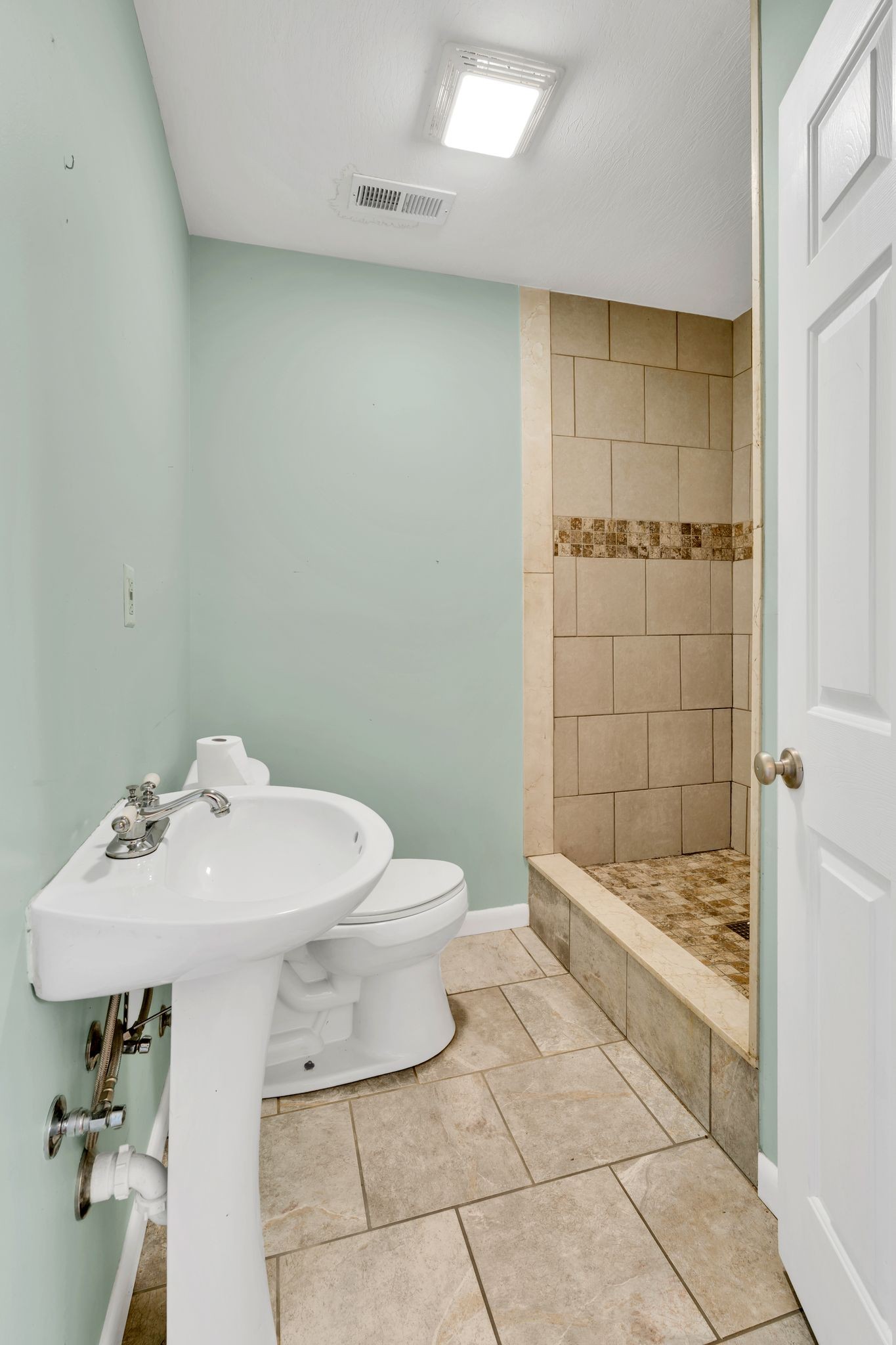 729 Rabbit Trail Road Leoma, TN 38468 - Photo 45 of 52 a bathroom with a sink a toilet and shower