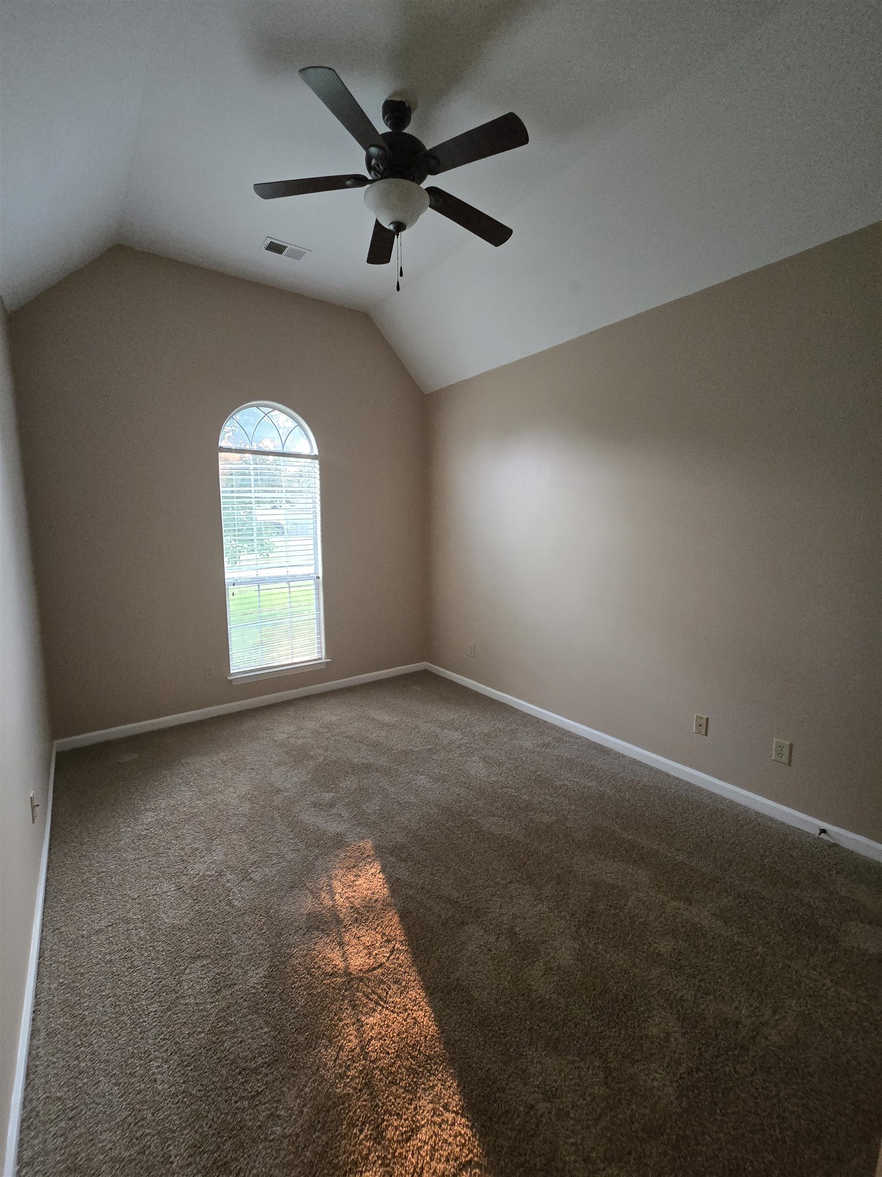 5186 Guffin Road Bartlett, TN 38135 - Photo 12 of 21 an empty room with a window and a fan