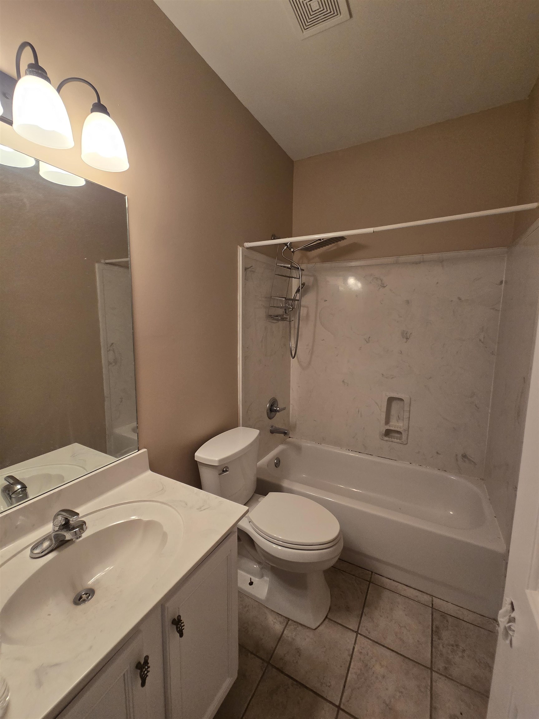 5186 Guffin Road Bartlett, TN 38135 - Photo 16 of 21 a bathroom with a sink a toilet and shower