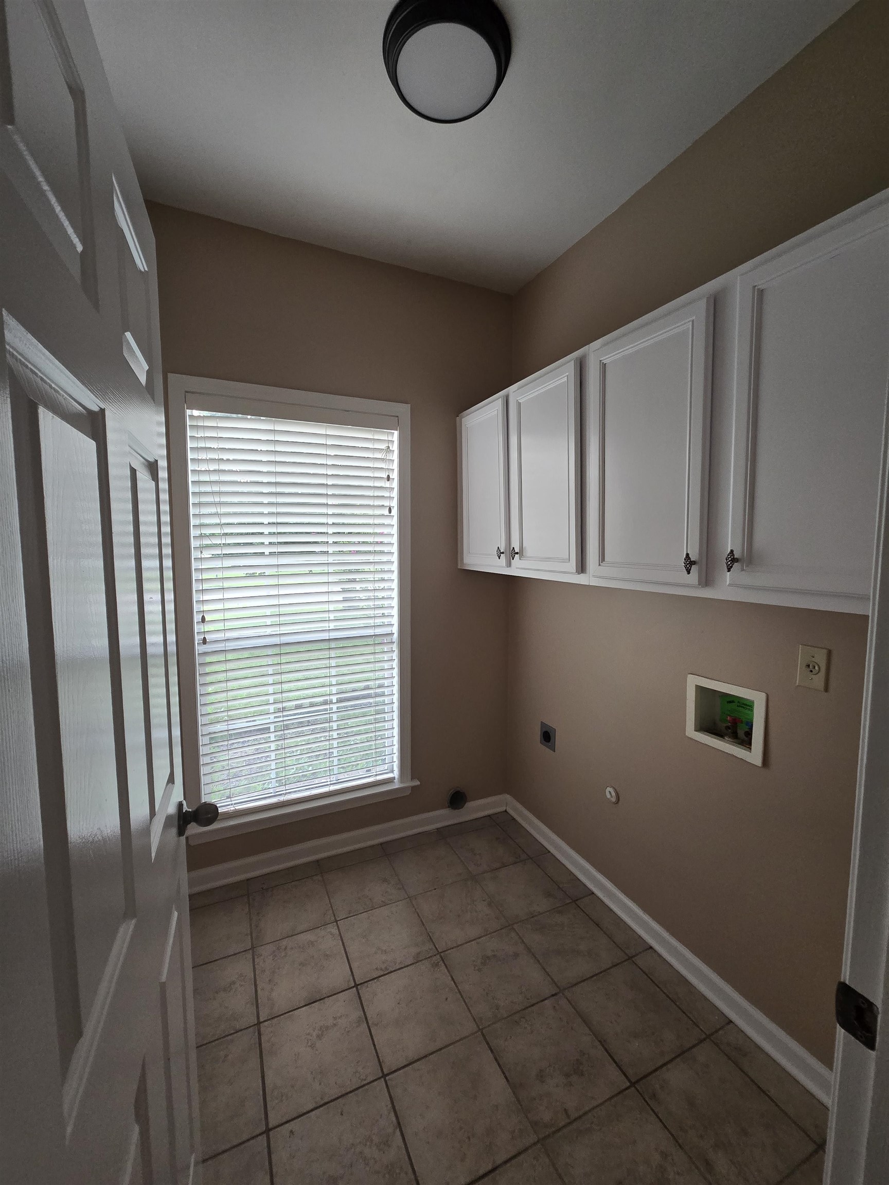 5186 Guffin Road Bartlett, TN 38135 - Photo 17 of 21 a view of a livingroom with an empty space and a window