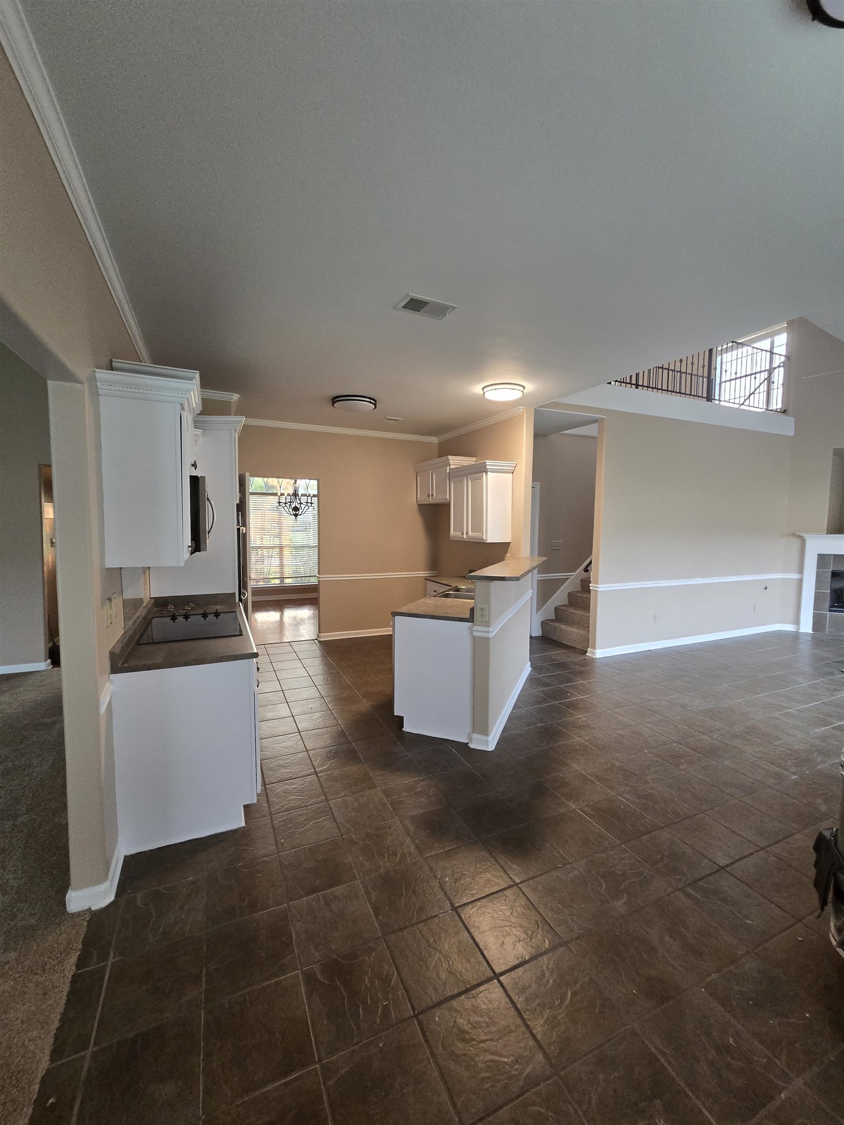 5186 Guffin Road Bartlett, TN 38135 - Photo 21 of 21 a large kitchen with granite countertop a stove a sink and a refrigerator